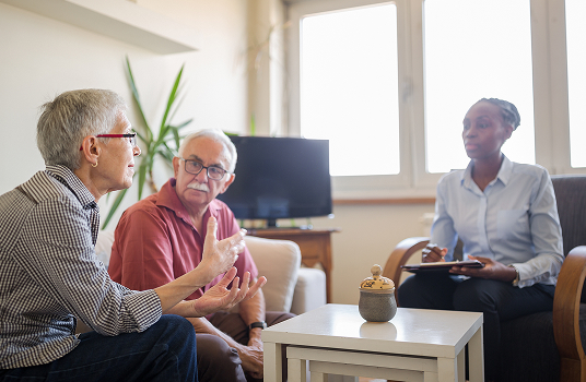Couple discussing early signs of dementia.
