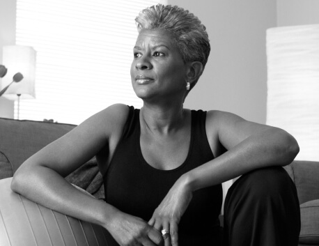 Woman leaning on exercise ball